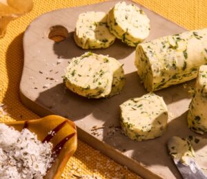 a vegan herb butter with lemon zest and herbs like dill, chives, parsley