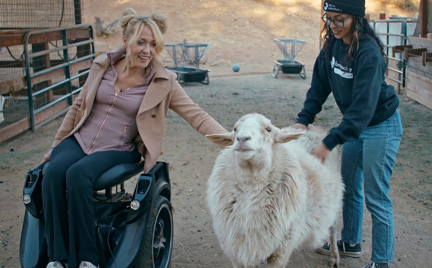 Gretchen Ryan with a sheep at Farm Sanctuary - a still from vegan film "Liberty"