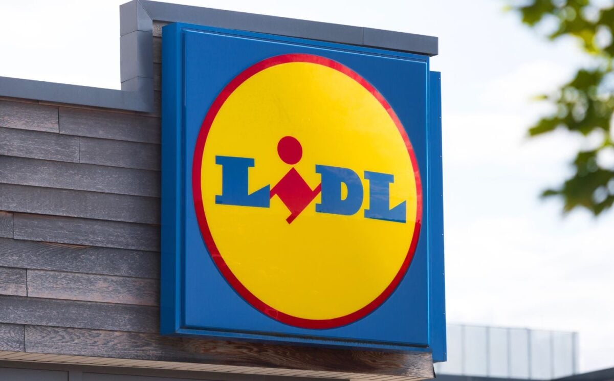 Photo shows a large Lidl sign on the front of a supermarket