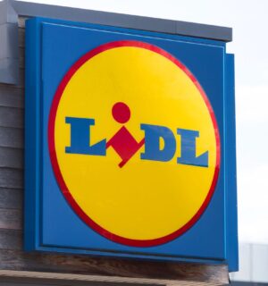 Photo shows a large Lidl sign on the front of a supermarket