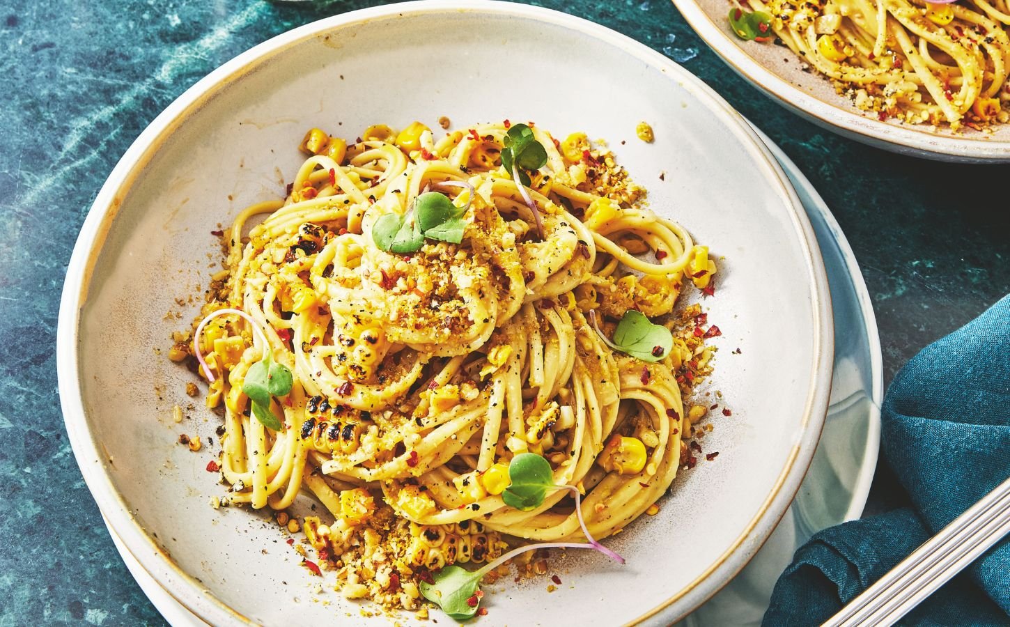 a bowl of miso creamy corn pasta with nutritional yeast