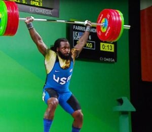 Photo shows American weightlifter and Olympian Kendrick J. Farris competing