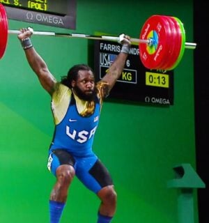 Photo shows American weightlifter and Olympian Kendrick J. Farris competing