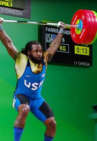 Photo shows American weightlifter and Olympian Kendrick J. Farris competing