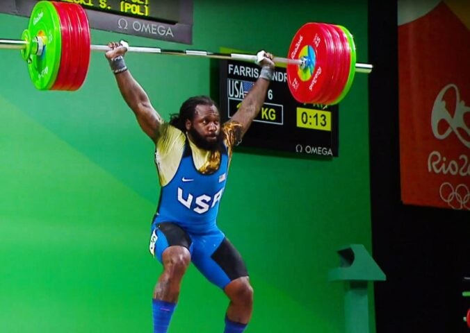 Photo shows American weightlifter and Olympian Kendrick J. Farris competing