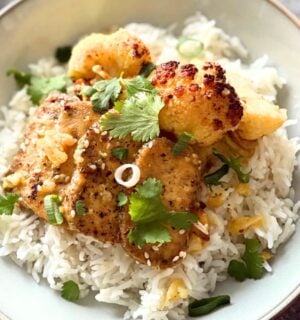 A plate of orange and ginger tofu with rice