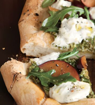 pesto plum pizza with balsamic arugula and basil soy ricotta