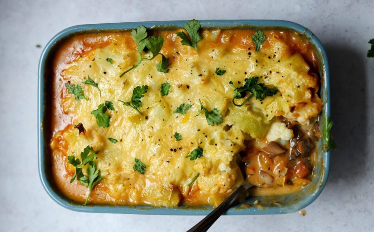 meat-free cottage pie with leek and cauliflower topping plus mushrooms, vegan grated cheese, and herbs, part of recipes containing five vegetables or more