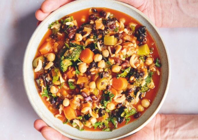 an Ikarian longevity stew filled with beans, chickpeas, lentils, kale, broccoli, part of recipes containing five vegetables or more