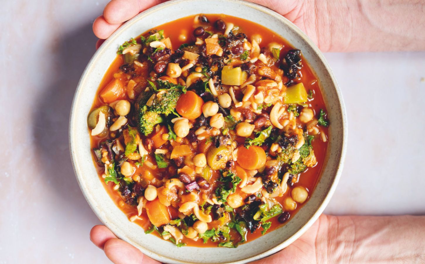 an Ikarian longevity stew filled with beans, chickpeas, lentils, kale, broccoli, part of recipes containing five vegetables or more