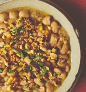 a bowl of butter beans with roasted corn and hazelnuts