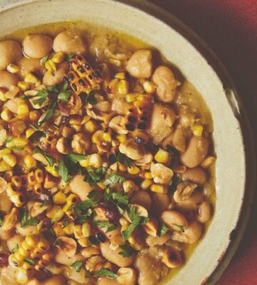 a bowl of butter beans with roasted corn and hazelnuts
