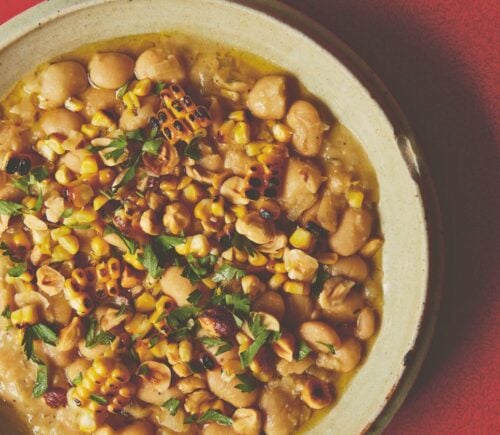 a bowl of butter beans with roasted corn and hazelnuts