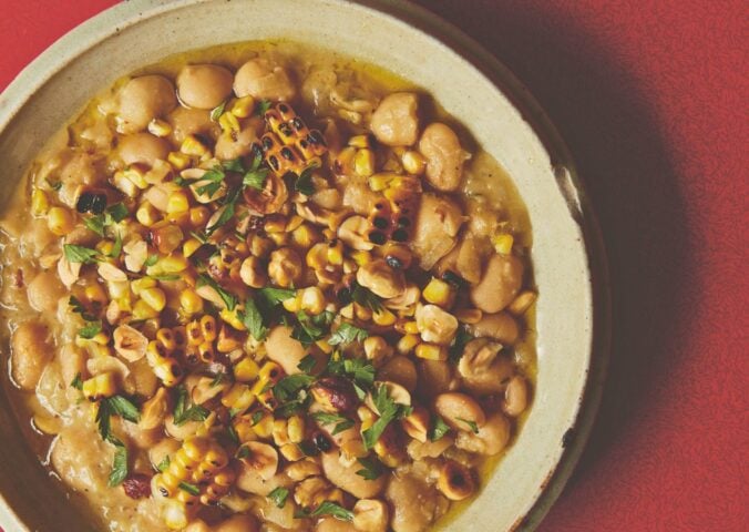 a bowl of butter beans with roasted corn and hazelnuts