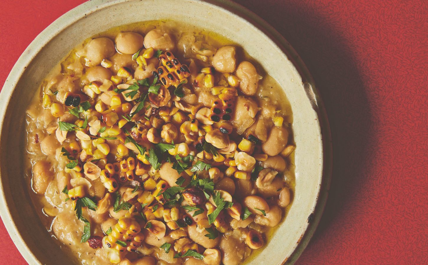 a bowl of butter beans with roasted corn and hazelnuts