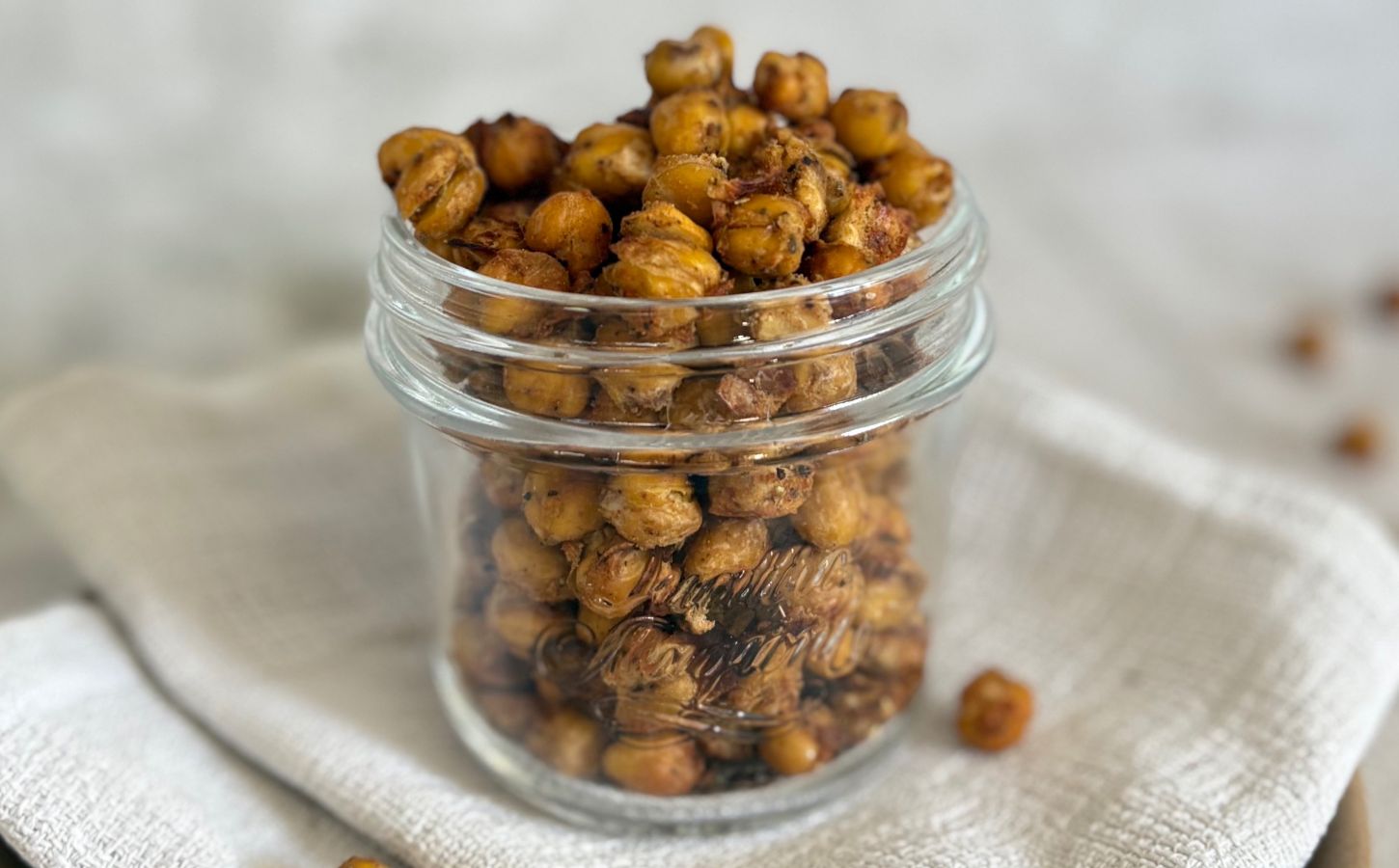 A glass jar of spiced chickpeas