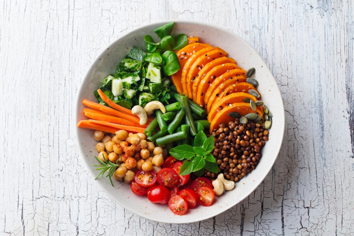 Photo shows a healthy, sustainable meal of vegetables, pulses, and other plant-based ingredients