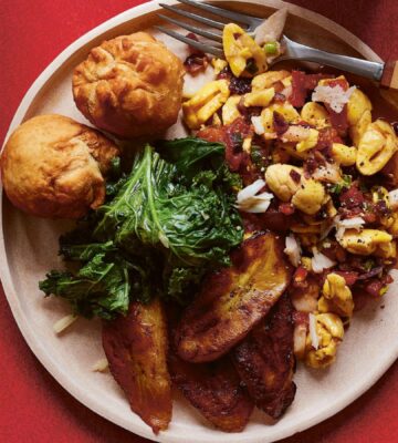 a plate of the ultimate Jamaican breakfast with palm hearts and kale