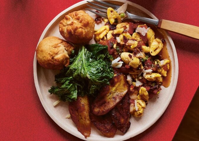 a plate of the ultimate Jamaican breakfast with palm hearts and kale