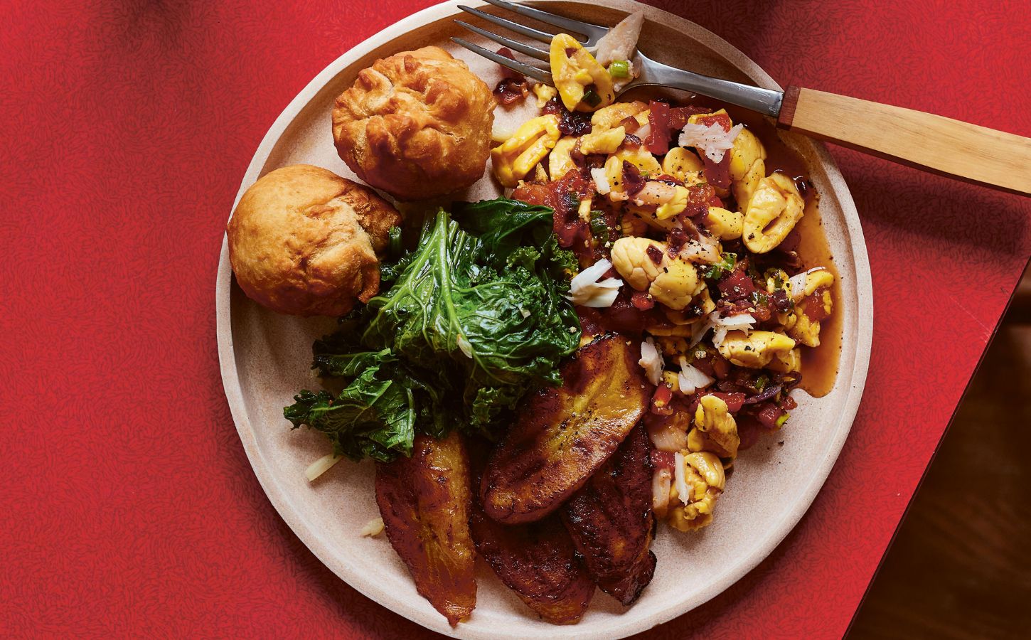 a plate of the ultimate Jamaican breakfast with palm hearts and kale