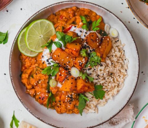 a bowl of creamy roasted butternut squash and spinach dahl