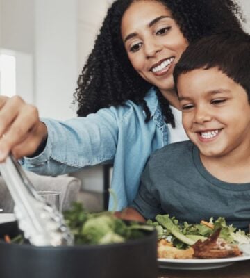 A family sitting down to eat a vegan meal together