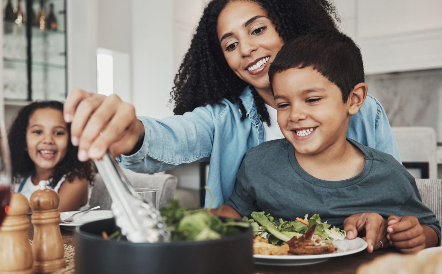 A family sitting down to eat a vegan meal together