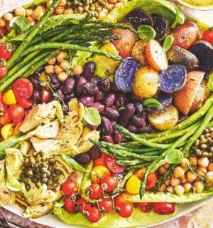 A vegan nicoise salad on a large plate