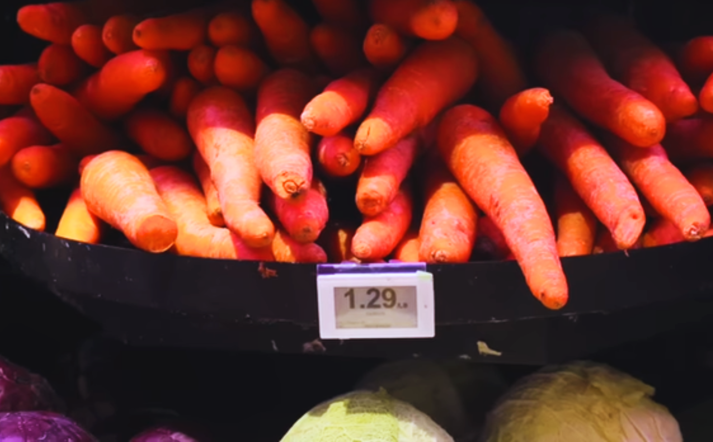 Imperfect - or "ugly" carrots - on a supermarket shelf