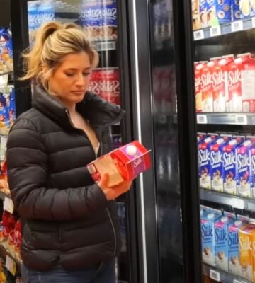 Plant-based YouTuber Candice Hutchings in a still from a video on vegan budget grocery shopping