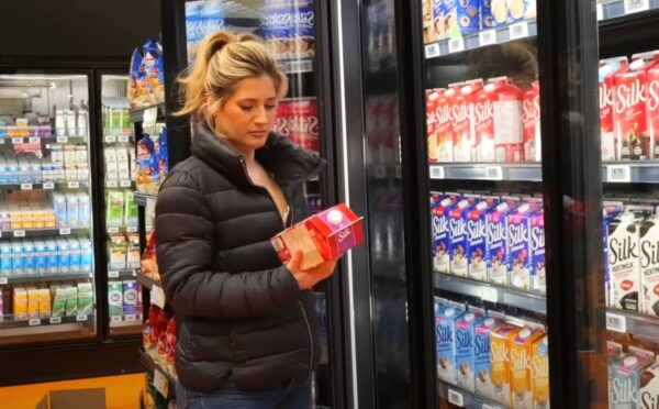 Plant-based YouTuber Candice Hutchings in a still from a video on vegan budget grocery shopping