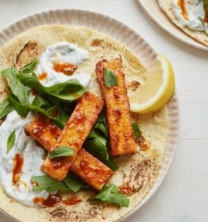 vegan harissa tofu wrap with spinach, mint, and coconut yogurt