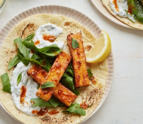 vegan harissa tofu wrap with spinach, mint, and coconut yogurt