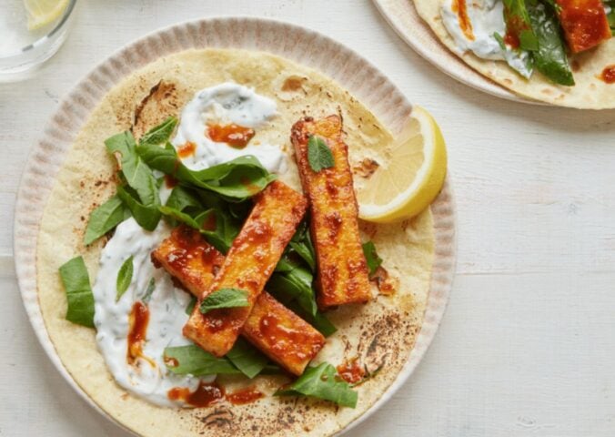 vegan harissa tofu wrap with spinach, mint, and coconut yogurt