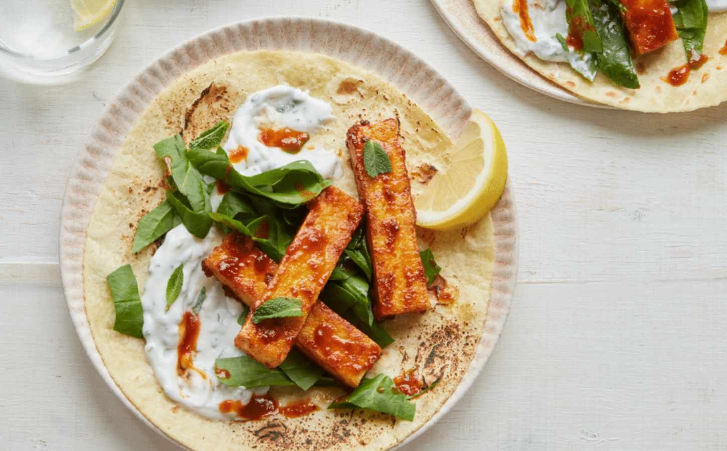 vegan harissa tofu wrap with spinach, mint, and coconut yogurt