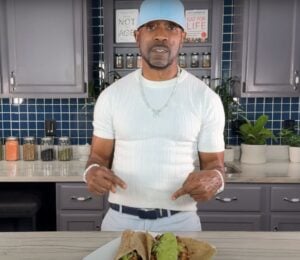 Plant-based YouTuber Javant B in a still from a video showcasing his wfpb healthy burrito recipe