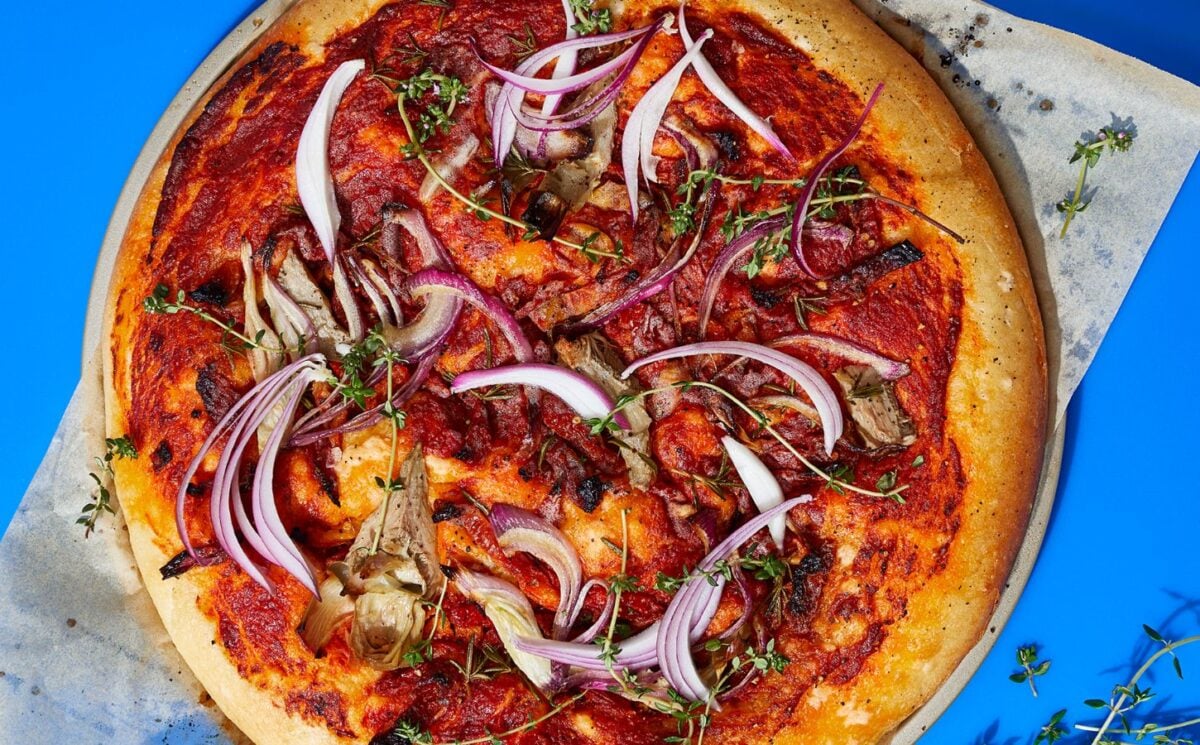 loaded focaccia slab with sun-dried tomatoes and artichokes