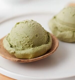 scoops of matcha nice cream with banana and matcha powder