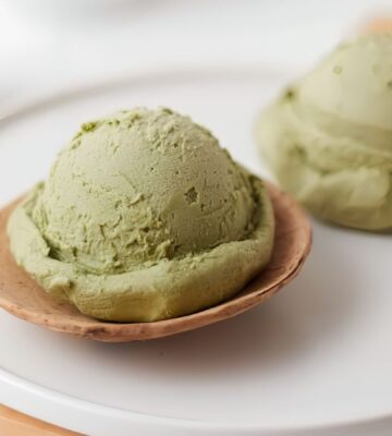 scoops of matcha nice cream with banana and matcha powder