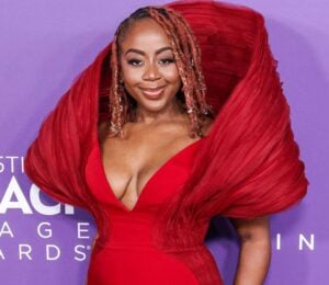 Slutty Vegan founder Pinky Cole Hayes on the red carpet in a red dress