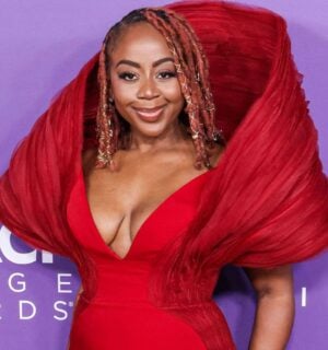 Slutty Vegan founder Pinky Cole Hayes on the red carpet in a red dress