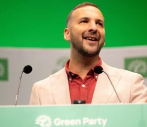 Photo shows Zack Polanski, the deputy leader of the Green Party, at a speaking event
