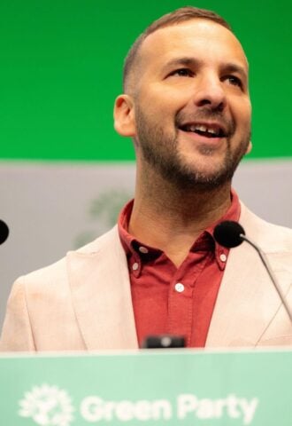 Photo shows Zack Polanski, the deputy leader of the Green Party, at a speaking event