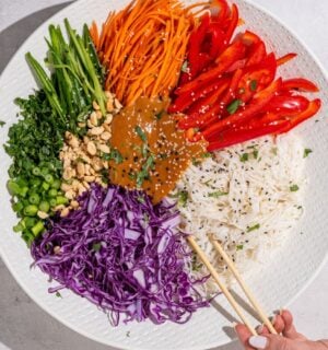 a beautiful bowl of spring roll salad with rice noodles and peanut dressing