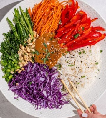 a beautiful bowl of spring roll salad with rice noodles and peanut dressing