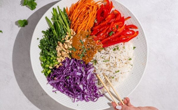 a beautiful bowl of spring roll salad with rice noodles and peanut dressing