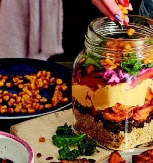 sweet potato rainbow salad with quinoa, corn. and cabbage