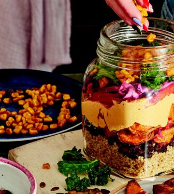 sweet potato rainbow salad with quinoa, corn. and cabbage