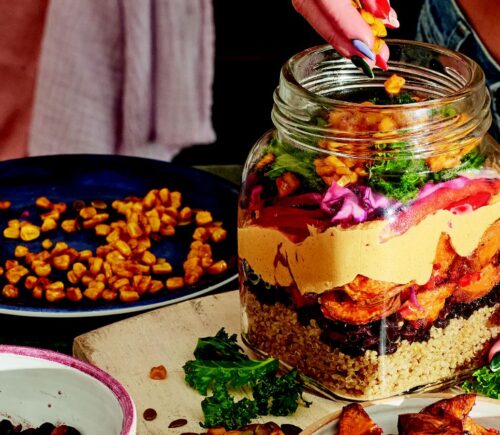 sweet potato rainbow salad with quinoa, corn. and cabbage