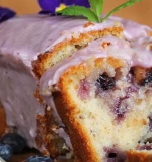 a lemon blueberry drizzle cake perfect for a list of vegan cakes to make this weekend